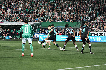Romano Schmid taking a shot at goal.