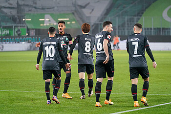 Werder players celebrating after a goal.