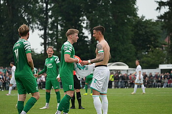 Marco Friedl giving his shirt to the opponent.