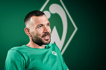 Markus Kolke in green and white.