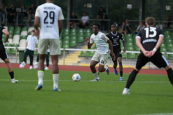 Wesley Adeh looks at the ball.