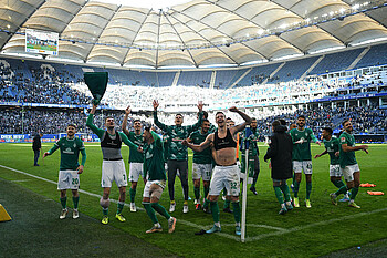 The players celebrate in front of the fans following the derby day win over HSV. 