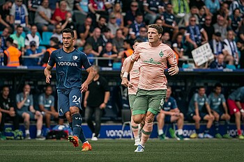 Jens Stage and a Bochum player during the game.