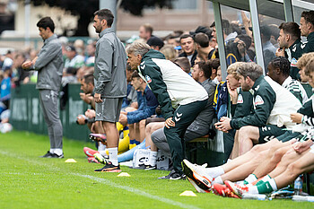 Horst Steffen looks out towards the pitch.