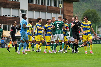 Players involved in a confrontation on the pitch.
