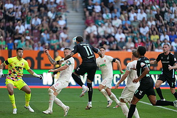 Marco Friedl competes for the ball with an opponent. 