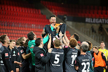 Pizarro is lifted up by his teammates