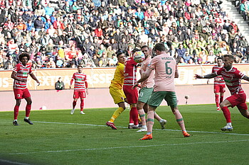 Jens Stage heading the ball in the Augsburg goal to make it 1-1.