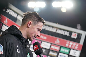 Marco Friedl speaks to the media.
