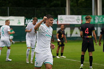 Dawid Kownacki celebrates scoring a goal. 