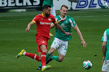  Christian Groß battles for possession with Leverkusen's Kerem Demirbay.